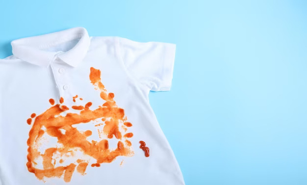 a white shirt with sauce and greasy stains on it